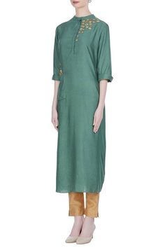 For a traditional look at work, pick this green silk blend tunic. It features 3D flower motif embroidery. Team it up with gold-toned pants to complete the look. 
Mandarin collar
Utility pockets
Three quarter sleeves - Aza Fashions Tunics Online, Applique Work, Flower Motif, Embroidered Tunic, Floral Applique, Green Silk, Indian Design, Womens Tunics, Green Fabric