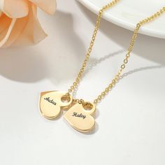 Celebrate love, family, or friendship with this beautiful Custom Engraved Heart Pendant Necklace. Available with the option to personalize 1 or 2 heart pendants, this delicate and timeless piece is the perfect way to keep your loved ones close to your heart. Each heart pendant can be engraved with a name, special date, or meaningful word, making it a truly unique and thoughtful gift for any occasion - from birthdays and anniversaries to Mother's Day or just because! KEY FEATURES: -Made with 316 Customized Heart Pendant Charm Necklaces For Anniversary, Customizable Heart Charm Necklace For Anniversary, Valentine's Day Anniversary Name Necklace With Charms, Heart-shaped Engraved Charm Necklace For Best Friend, Customized Heart Pendant Charm Necklaces For Valentine's Day, Personalized Double Heart Charm Necklace For Personalized Gift, Engraved Heart Charm Necklace For Best Friend, Personalized Double Heart Necklace For Best Friend, Engraved Double Heart Charm Necklace For Personalized Gift