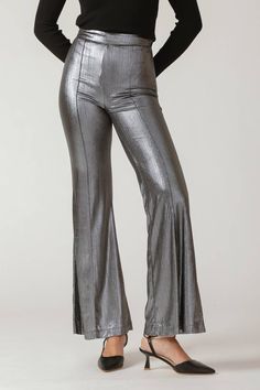 A foil coated woven pant featuring side zipper and flare leg. Matching top IT13409Details:Self: 95% Polyester 5% SpandexLining : 100% PolyesterSize & Fit- Model is 5`8" And Wearing Size Small- Measurements Taken From Size Small- Approx. Length: 44" Matching Top, Women Set, Side Zipper, Fitness Models, Foil, Spandex, Zipper, Pants, Silver