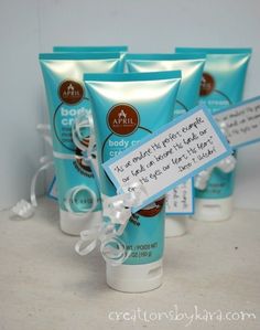 three tubes of body lotion sitting next to each other on top of a counter