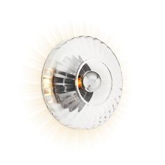 a light that is sitting on top of a wall mounted fixture with an orange light in the middle