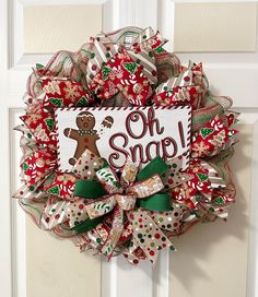 a christmas wreath hanging on the front door