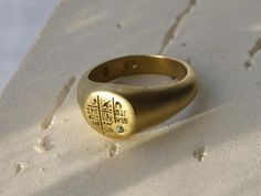 The Seti ring is engraved with intricate hieroglyphs of ancient Egyptian mysteries and set with a 1.6mm natural emerald to symbolise renewal and vitality. Named after Pharaoh Seti I, a powerful ruler of the 19th Dynasty known for his military prowess and monumental constructions, including the grand temple at Abydos. Seti's reign marked a period of revival in Egypt's fortunes, and this ring captures his legacy of strength and prosperity. A timeless piece, the Seti Ring blends ancient history wit Symbolic Oval Engraved Ring For Ceremonial Occasions, Ceremonial Gold Engraved Ring With Engraving Option, Spiritual Oval Engraved Ring In Yellow Gold, Spiritual Yellow Gold Engraved Oval Ring, Spiritual Oval Engraved Yellow Gold Ring, Spiritual Engraved Oval Yellow Gold Ring, Spiritual Engraved Yellow Gold Oval Ring, Engraved Gold Emerald Ring As A Gift, Heirloom Gold Engraved Emerald Ring