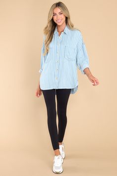 Looking for an effortless classic? This Always Lovely Blue Striped Top is your go-to for effortless, casual style. Throw it on and get ready for the compliments! This top features a collared neckline, functional buttons down the front, two functional bust pockets, long sleeves with buttoned cuffs, a scoop bottom hem, and a super soft material. Model is wearing a small. • 100% Lyocell • Hand Wash Cold • Unlined • Imported Blue Button-up Tops For Casual Gatherings, Versatile Blue Collared Top, Versatile Blue Button-up Top, Versatile Blue Top With Button Closure, Blue Striped Top, Nude Bra, Top Hits, Chambray Top, Red Dress Boutique