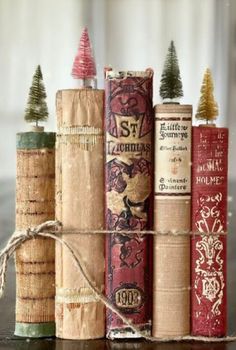 books wrapped in twine with christmas trees on top