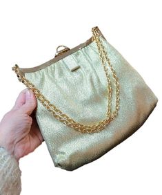 "Gorgeously sparkling vintage evening bag in a metallic gold glitter fabric! Inside is just as special with a gold satiny lining! Gold chain can be used doubled or single. Circa 1960's and Measurements: 8 1/2\" x 7 3/4\" plus clasp, plus chain, about another 8\" Purse is in good condition. Please see all photos. Packaging: Offbeat Avenue uses recycled packaging whenever possible! Questions? We're here to help! Send us a convo and we will respond as quickly as possible. Shop policies: https://www Gold Glitter Evening Bag For Wedding, Gold Glitter Evening Bag For Party, Chic Gold Evening Bag With Glitter, Gold Glitter Evening Bag For Formal Occasions, Gold Evening Bag For Gala, Vintage Evening Bag For Party, Retro Gold Bag For Events, Gold Evening Bag With Gold-tone Hardware For Gala, Chic Gold Bags For Vintage Events