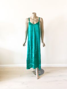 This is 100% pure satin slip hand dyed dress in teal. The perfect minimalist gown for the woman who adores luxury and simplicity. There is something so special about a bias cut silk gown and natural silk epitomizes that effortless glamour.  Our Silk gown is so buttery soft that you'll never want to take it off. This dress does triple duty as a night gown, slip dress or just a slip! This will be your favorite piece to pack away to that island paradise or to wear at home.  Add a sweater, jacket, or wear it on its own and you have the perfect outfit for dinner and dancing! A silky feel that adds femme sophistication to any look, this camisole/lingerie dress is a delicate piece you'll find yourself reaching for again and again. Subtle shine lends a classic charm to its versatile silhouette. Ma Minimalist Gown, Silk Satin Dress, Island Paradise, Silk Lingerie, Silk Gown, Lingerie Dress, Dinner Outfits, Dyed Dress, Satin Slip