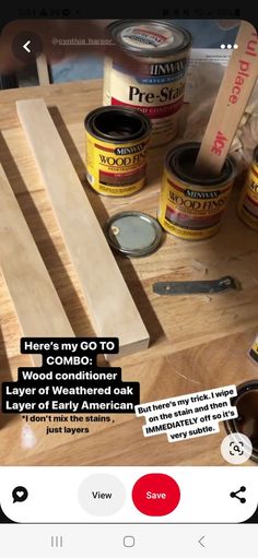 a wooden table topped with lots of different types of paint and woodworking tools on top of it