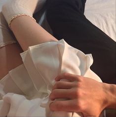 a woman's arm wrapped in white cloth