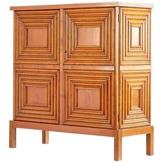 a wooden cabinet with four doors and two drawers