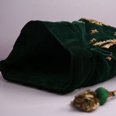 "Green Velvet Fabric Traditional Peacock Embroidered Zardosi Work Bridal Wedding Potli Bag Evening Handbag For Women Material:Velvet Fabric, Golden Metallic Thread, Golden Metallic Wire, Motifs, Sequin Color: Dark Green Package Contents: 1 Size: 10\" x 8\" Designed with the heart, this beautiful Potli or batawa bag are eye catchy and made of premium material. Key Features: Embroidery art work This potli is good match with both Indian and western outfits and are superb for wedding and festive par Green Bag With Zari Work For Wedding, Green Zari Work Potli Bag For Wedding, Elegant Ceremonial Bags For Festive Season, Elegant Ceremonial Festive Bags, Traditional Party Bag With Intricate Embroidery, Festive Potli Bag With Gold Embroidery, Traditional Green Bag For Festive Occasions, Traditional Green Bag For Festive Season, Festive Green Potli Bag With Zari Work