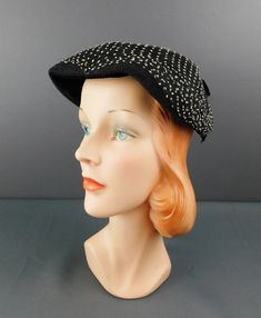 Vintage Black 1950s Hat with Black & White Netting ERA: True vintage hat from the 1950s MEASUREMENTS: The hat will fit a 21 to 22 inch head, will need a pin to secure MATERIAL: straw, netting LABEL: none Black creped straw hat with black netting over the top that has white specks on it. Black velvet under the front of the hat and a black velvet bow on the back.  CONDITION: Excellent condition. Vintage Flat Cap For Formal Occasions, Black Retro Party Hat, Retro Black Party Hat, Vintage Brimmed Cloche Hat For Evening, Retro Cloche Hat With Curved Brim For Evening, Vintage Black Cloche Hat With Curved Brim, Vintage Cloche Hat With Short Brim For Evening, Retro Curved Brim Cloche Hat For Evening, Black Vintage Cloche Hat With Curved Brim