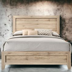 a wooden bed with two pillows on top of it next to a wall and floor