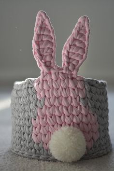 a crocheted bunny head on top of a basket