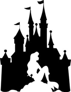 the silhouette of a mermaid in front of a castle