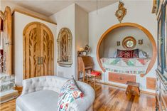 a living room filled with furniture and wooden floors