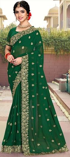 Green color Saree in Georgette fabric with Embroidered, Stone, Thread, Zari work Embroidered Traditional Drape For Marriage, Ceremony Embroidered Semi-stitched Saree, Traditional Embroidered Saree For Ceremony, Green Georgette Embroidered Fabric For Wedding, Green Dupatta With Pallu For Ceremony, Embroidered Saree For Ceremonies And Festivals, Ceremony Green Embroidered Dupatta, Green Traditional Wear For Ceremonial Festivities, Green Traditional Wear For Ceremony And Festive Occasion