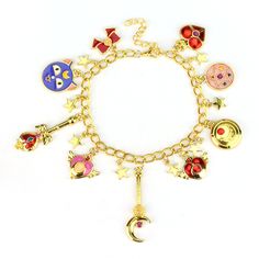 the charm bracelet has many charms on it and is decorated with stars, crescents, moon