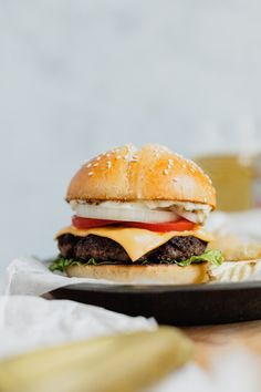 a cheeseburger on a plate with fries