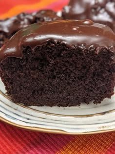 a chocolate cake with frosting on a plate