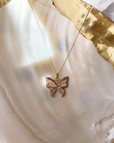 Give her the gift of wings with this beautiful butterfly necklace. DETAILS - 14k yellow gold butterfly with rhodium plating - Chain option is a 14k yellow gold cable chain - Chain style may vary slightly - Approximately 3/4 inch wide x 3/4 inch tall (including bail) VARIATIONS If you require any variation of this style (a different style chain, longer chain, etc.) feel free to message us. We will do our best to accommodate you. Additional costs may apply depending on the variation. POLICY We do Butterfly-shaped Yellow Gold Jewelry With Diamond Accents, Fine Jewelry Butterfly Pendant With Diamond Accents, Fine Jewelry With Butterfly Diamond Accents, Fine Jewelry Butterfly With Diamond Accents, Fine Jewelry Butterfly Necklace With Diamond Accents, Butterfly Shaped Jewelry With Diamond Accents For Gifts, Yellow Gold Wing-shaped Jewelry, Dainty Yellow Gold Butterfly Jewelry, Dainty Butterfly Yellow Gold Jewelry