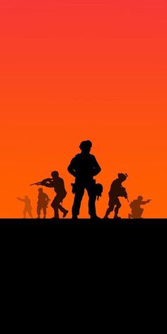 silhouettes of soldiers against an orange sky