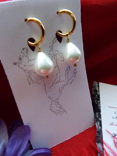 Pearls are timeless. These are South Sea Shell Pearls with gold-plated hoop leverbacks, gold-filled earwires or leverbacks, and/or sterling silver earwires or leverbacks. They look perfect with ANYTHING - even pajamas. SS is Sterling Silver, GF is Gold Filled, LB is Leverback, and EW is Earwire. They hang about 1-1/4 inches long. The pearls are beautiful, and I also have them in a very light pink pearl. The champagne pearl version is glass. If you do not have pierced ears, I have very nice clip- Classic Clip-on Hoop Earrings As Gift, Classic Gold Hoop Earrings With Pearl Drop, Classic Small Hoop Gold Pearl Earrings, Elegant Clip-on Huggie Earrings For Gift, Elegant Clip-on Huggie Earrings As Gift, Elegant Adjustable Dangle Huggie Earrings, Classic Handmade Teardrop Hoop Earrings, Gold Huggie Pearl Earrings With Ear Wire, Elegant Teardrop Huggie Earrings With Lever Back