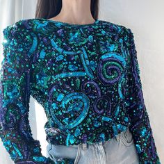 Details Blue/Green And Purple Sequin Long Sleeve Blouse Shoulder Pads Multi-Color Sequin Back Zipper With Hook And Eye Lined Bodice V Front And Back Hem 100% Silk Condition: Item Is Deadstock (With Tags) Vintage So It Is Mint Condition Decade: 1980's Brand: Laurence Kazar Sizing Size: Xl But Fits More Like A Large Measurements Pit To Pit: 19 ½” Waist: 16 ½” Length From Hps: 21 ½” Bicep: 6 ¾” Sleeve Opening: 4 3/4 X Excellent Vintage Condition. Item Has Been Cleaned And Is Ready To Wear. Xx Comes Blue Embellished Long Sleeve Top, Blue Long Sleeve Sequin Top, Blue Sequin Top For Fall, Blue Sequined Tops For Fall, Blue Embellished Top For Evening, Blue Embellished Tops For Fall, Vintage Multicolor Tops For Party, Magenta Top, Black Crochet Top