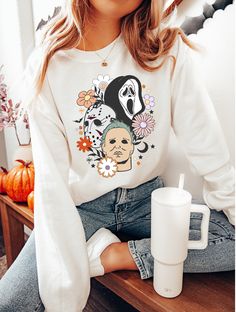 Spooky season is here! ♡ The perfect retro + nostalgic comfy sweatshirt for your pumpkin picking and hay ride adventures ♡ Measurements: Available in sizes S-5XL Comfy, unisex crewneck sweatshirt. Looser fit - If you prefer a tighter fitting shirt, we recommend sizing down. Care Instructions: Machine wash: warm Tumble dry: low heat Iron, steam or dry: medium heat No dry cleaning .: Loose fit .: 50% Cotton; 50% Polyester (fibre content may vary for different colors) .: Medium fabric (8.0 oz/yd² ( Fall Pop Culture Crew Neck Sweatshirt, White Sweatshirt For Fall Fan Merchandise, Halloween Fan Merchandise Sweatshirt With Graphic Print, Pop Culture Graphic Print Sweatshirt For Fall, Fall Pop Culture Long Sleeve Sweatshirt, Pop Culture Cotton Sweatshirt For Fall, Fall Cotton Sweatshirt With Pop Culture Style, Trendy Fall Sweatshirt With Character Print, Trendy Character Print Sweatshirt For Fall