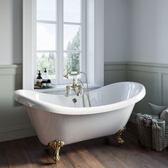 a white bath tub sitting next to a window