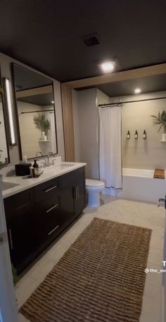 a bathroom with a rug on the floor