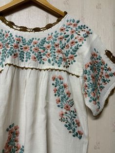 Mexican style hand-embroidered blouse is made from 100% cotton soft and light which makes you so comfortable. Split sleeve is tighten with hand crochet. Color : Ivory Measurement is laid flat in inches (approximately) - one size fits most (S-L). Loose style depend on preferred fit - arm hole : 20" - bust : 42" - sleeve length : 7.5" - waist : open - hips : 52" - shoulder to bottom hem : 26.5" More beautiful blouses link : http://www.etsy.com/shop/chokethai?section_id=11663201 Bohemian Embroidered Relaxed Fit Blouse, Embroidered Bohemian Peasant Top With Relaxed Fit, Bohemian Embroidered Peasant Top With Relaxed Fit, Bohemian Embroidered Relaxed Fit Peasant Top, Bohemian Embroidered Cotton Top With Relaxed Fit, Bohemian Style Embroidered Cotton Top With Relaxed Fit, Relaxed Fit Bohemian Embroidered Cotton Top, Bohemian Style Relaxed Fit Embroidered Cotton Top, Cotton Peasant Top With Embroidered Hem