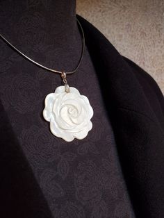 This is a lovely piece.  Simple, yet stunning and sophisticated.  Perfect for your 'Big Day'  The delicate flower motif made from Mother of Pearl has a rich cream colour.  I have hung it simply on a 12" Sterling Silver Choker.  I have added a 3" extension chain for your comfort.  Minimalist yet striking!  Just perfect.  The pendant is 5cms overall the flower motif is 4cms round.  Pearl for a 30th Wedding Anniversary too! Formal White Flower Necklaces, Formal White Flower-shaped Necklaces, Formal White Flower Shaped Necklace, Formal White Flower-shaped Necklace, Elegant Petal-shaped Wedding Necklaces, Elegant Jewelry For Special Day, Elegant White Flower Necklace, Formal White Jewelry With Rose Design, Elegant Silver Necklace For Special Day