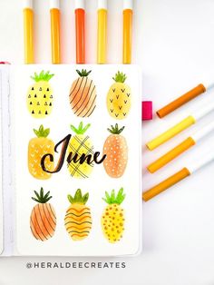 an open notebook with pineapples and oranges on it