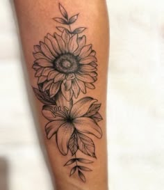 a black and white photo of a sunflower tattoo