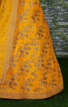 A perfect definition of superb craftsmanship in this beautiful Yellow colored designer sabyasachi bridal lehenga choli.
Beautified with amazing heavy embroidery with zari,dori & sequence work within the attire adds a sign of elegance statement with your look.
The semi-stitched lehenga is made of Thai Silk fabric accompanied with unstitched embroidered matching fabric blouse piece and embroidered Thai Silk dupatta.
Suitable to wear for wedding functions, engagement ceremony and special occasi Yellow Chanderi Anarkali Set With Dori Work, Yellow Sharara With Dori Work, Yellow Anarkali Set With Dori Work For Eid, Yellow Anarkali Set With Zari Work, Yellow Anarkali Salwar Kameez With Dori Work, Designer Yellow Salwar Kameez With Dori Work, Yellow Silk Sharara With Dupatta, Yellow Floor-length Dupatta For Reception, Yellow Anarkali Set With Dori Work