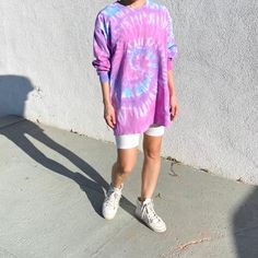 "Our long sleeve tie-dye top comes in two colors. The shirt comes in one size and is modeled on both a petite (5'2\"} woman and tall (6'1\") man. It's the perfect oversized fit on a smaller person that can be worn with biker shorts or belted as a dress. The Sunset colorway was designed with our hometown of Los Angeles in mind. Sizing: One Size (Men's large) Care: Machine wash with like colors; tumble dry low" Casual Long Sleeve Hand Dyed Tops, Casual Hand Dyed Long Sleeve Tops, Oversized Acid Wash Sweatshirt For Spring, Hand Dyed Long Sleeve Tops For Spring, Casual Long Sleeve Bleached Tops, Acid Wash Long Sleeve Tops For Loungewear, Acid Wash Long Sleeve Tops For Summer, Trendy Acid Wash Long Sleeve Tops, Acid Wash Hand Dyed Tops For Loungewear