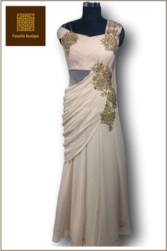 Outstanding Beige Colour Saree Gown In Georgette Presenting this outstanding Beige Colour Saree Gown In Georgette And Hand Embroidery with Zari, Stones and beads. This is a presentable outfit for a perfect occasion. The gown can be cutomised according to your wish. Elegant Side Open Georgette Dress, Evening Gown With Resham Embroidery In Traditional Drape, Sleeveless Georgette Gown For Wedding, Sleeveless Dori Work Wedding Dress, Hand Embellished Floor-length Evening Dress For Reception, Festive Side Open Georgette Dress, Fitted Evening Dress With Traditional Drape, Anarkali Evening Dress With Resham Embroidery For Wedding, Evening Embroidered Pre-draped Saree