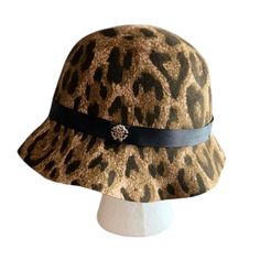 Preowned And In Great Condition. Leopard Print In Brown, Black, And Tan Tones. Made Of 100% Wool Black Ribbon With Gold Tone Hardware. Please See Photos For Condition And Approximate Size. Please Ask Any Questions Prior To Purchasing. Summer Leopard Print Adjustable Hat, Cheetah Bucket Hat, Leopard Print Beanie, Roberto Cavalli Animal Print, Leopard Print Fur Hat, Black Ribbon, Roberto Cavalli, Leopard Print, Bucket Hat