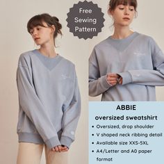 a woman wearing an abbie sweater with the text abbie over sized, drop shoulder v - neck ribbing detail available sizes xs xxs 5xl and 4xl