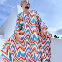 Hand made From start to finish boho wedding kaftan viscose fabric  Men's  caftan Ponchos Billowy dress Unique design rainbow color , multicolor geometric print from Small to 5XL size options Plus size Feel free to Ask for custom made custom made hemline  Gift for him Super comfortable men's clothing  to wear at home or outdoor Comfortable and chic For my all caftans and robes shop link: www.etsy.com/shop/mnouss/ worldwide fast shipping And my new shop link- caftan and more-  www.etsy.com/shop/ma Bohemian Multicolor V-neck Thobe, Bohemian Multicolor Thobe For Festivals, Multicolor Long Thobe For Summer, Bohemian Multicolor Summer Thobe, Multicolor Summer Thobe For Beach, Spring Vacation Tunic Thobe, Spring Vacation Thobe Tunic, Multicolor Summer Beach Thobe, Long Sleeve Multicolor Kaftan For Vacation