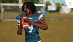 a man in a football uniform holding a ball