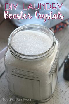 a mason jar filled with white liquid and the words diy laundry booster crystals on it