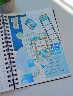 a spiral notebook with an image of a ladder on the cover and words written in it