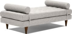 a gray couch sitting on top of a wooden frame