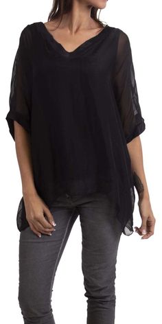 Gentle flowing pure silk, double V-neck silk blouse. Short sleeve finished with wide double-layer hem. Exterior 100% Silk | Interior 95% Viscose, 5% Elastic Model 5'8" One Size Made in Italy Sheer V-neck Blouse For Work, Black V-neck Rayon Blouse, Elegant Silk V-neck Tunic, Solid V-neck Viscose Blouse, Versatile Viscose V-neck Blouse, Versatile V-neck Blouse In Viscose, Flowy Viscose Tunic, Flowy Chiffon V-neck Blouse, Sheer Silk Tops