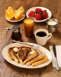 french toast and orange juice on a wooden table