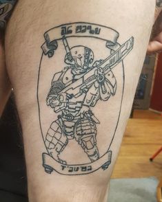 a man with a tattoo on his leg that has a drawing of a hockey player