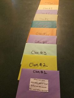 a long row of sticky notes sitting on top of a table