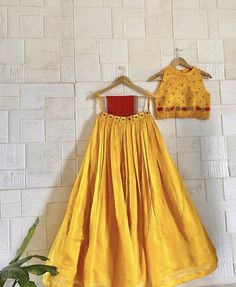 lehenga set  |womens lehenga choli |yellow red crop top lehenga set |designer haldi lehenga dupatta | wedding lehenga choli | lehenga usa Women's lehenga set /chiniya choli /teens embroidery lehenga skirt with dupatta /voggish      lehengas are one of the beautiful and versatile traditional attires of india !! we carry such pieces in budget with great quality that can be styled in multiple ways with different outfits !!       Here is Beautiful indo western hand embroidery soft tissue crop top in yellow color with hand embroidery paired with soft silk heavy gear skirt and contrast red dupatta as shown!! Skirt has heavy gear and both pieces can be mix and matched with different outfits !! Ready to ship All over the world !! details:  - blouse has halter neck(can be customized )and hand embro Festive Maxi Lehenga With Gota Work, Diwali Lehenga With Gota Work In Maxi Length, Party Lehenga With Gota Work, Designer Wear Choli With Long Skirt For Navratri, Designer Choli For Navratri With Long Skirt, Navratri Lehenga With Dori Work, Maxi Length, Festive Party Wear Long Skirt, Yellow Maxi Length Party Sets, Yellow Maxi Party Sets